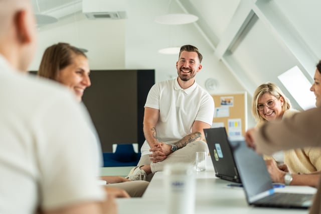 people having a good time at work laughing