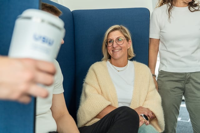 woman with a yellow sweater smiling