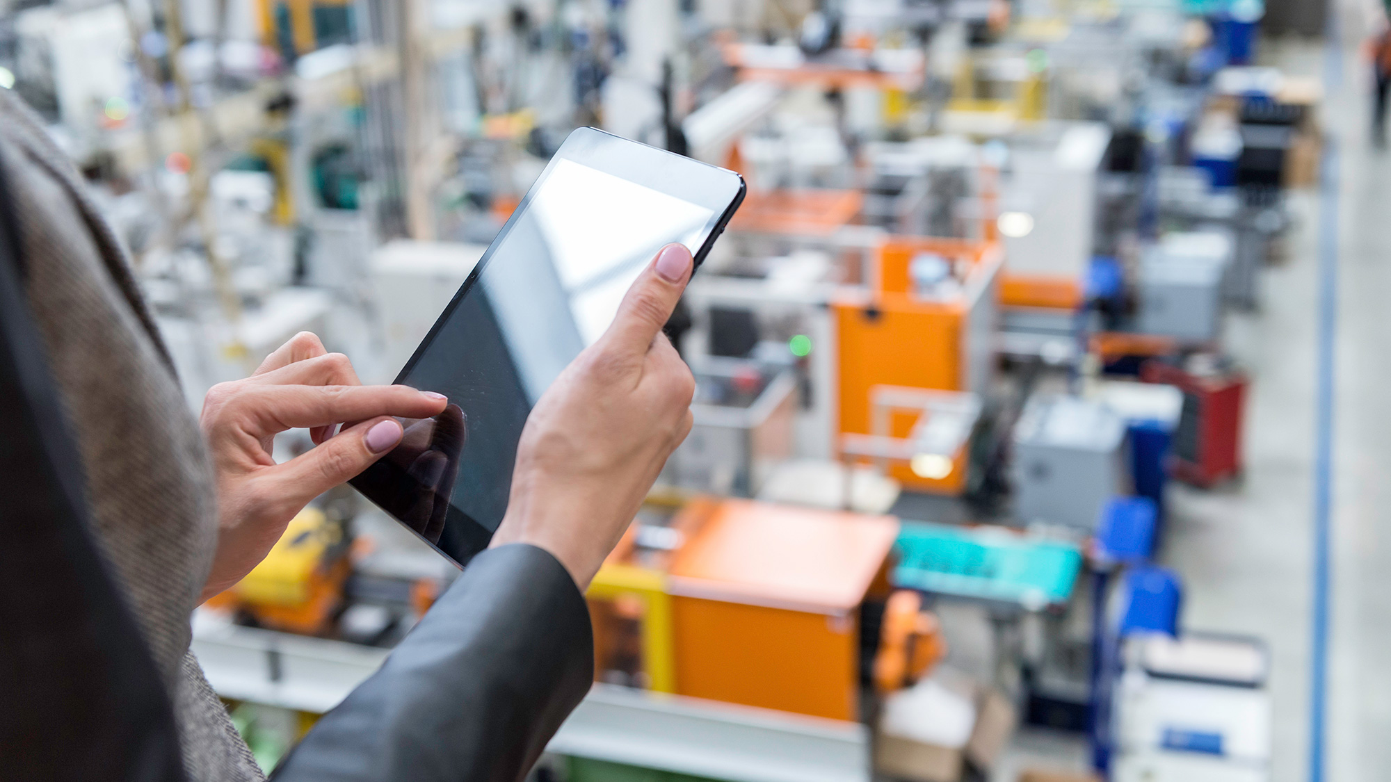 Man with Tablet and Machines